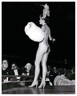 Press photo dated from the mid-50’s features a 77-year old woman attending a performance at NYC&rsquo;s famed &lsquo;LATIN QUARTER&rsquo; nightclub.. The photo accompanied a tabloid magazine&rsquo;s article detailing her reactions to the nudity displayed