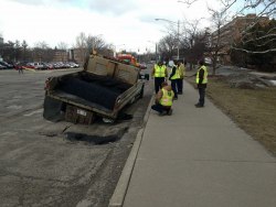 memewhore:  Pothole repair truck irony.