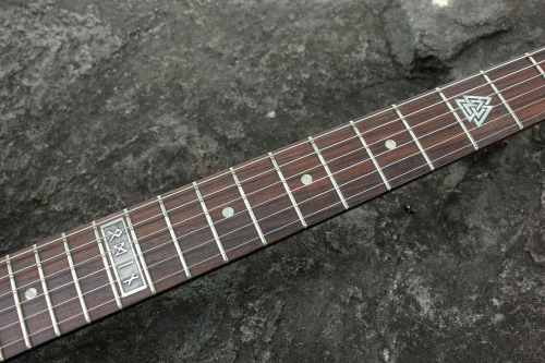 glorifiedguitars:  The Norse SG, featuring carvings of Odin with his two ravens Huginn and Muninn and his two wolves Geri and Freki.This beautiful piece of art was created by the talents at Hutchinson Guitar Concepts. 