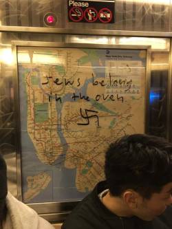 sixpenceee:  Manhattan subway gets covered in Swastikas on every