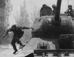historicaltimes:  Fidel Castro leaps of a tank during the Bay