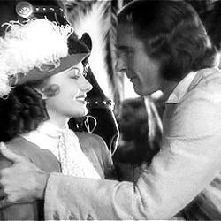 classicactresses:  Olivia de Havilland & Errol Flynn + Kisses