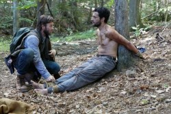 boundhung: Christopher Abbott is tied to a tree, shirtless and
