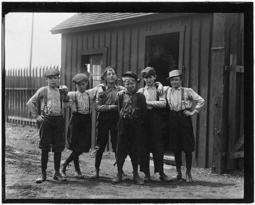 Noon break at glass factory, East St. Louis, Missouri. 1910.