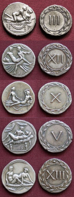 sixpenceee:The above coins are spintria. They are small bronze