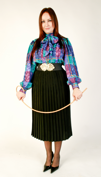 A pleated skirt, a thin whippy cane and a punishment bench with