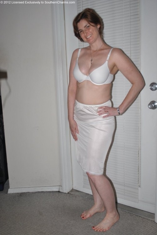 blueslipman:  Beautiful woman in a white nylon half slip.