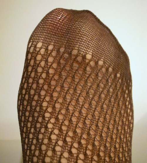 Fishnets over tan tights