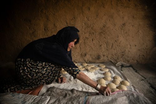 molkolsdal:Hafiza makes bread in preparation for a family gathering.