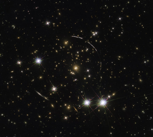 space-pics:  Gravitationally Lensed “Sunburst Arc” Galaxy