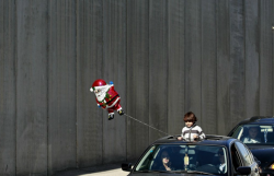 cameralens:  Nassar Shiyoukhi/AP Photo Santa led the way for