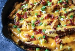 foodfuckery:  Skillet Oven Fries with Cheddar, Bacon, Pickled