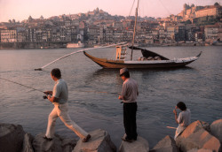 dolm:    Portugal. Porto. A barco rabelo carries Porto wine down