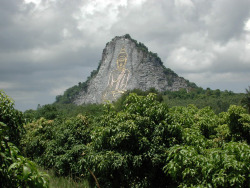 This cliff in Chonburi, south of Pattaya, Thailand, has a Buddha