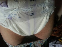 abcubs:   The plus side of wearing diapers just a little too big for you, the tapes almost touch and you can pretend your a little twink.  