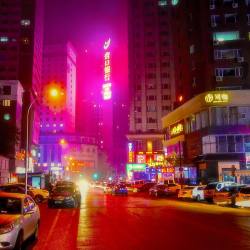 hikosaemon:  Neon lights radiate off nighttime smog in Dalian