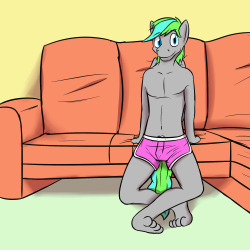 Greylove modeling a simple pair of pink swim trunks.  Despite