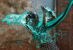 killing-the-prophet:  A girl reacts as coloured water is thrown