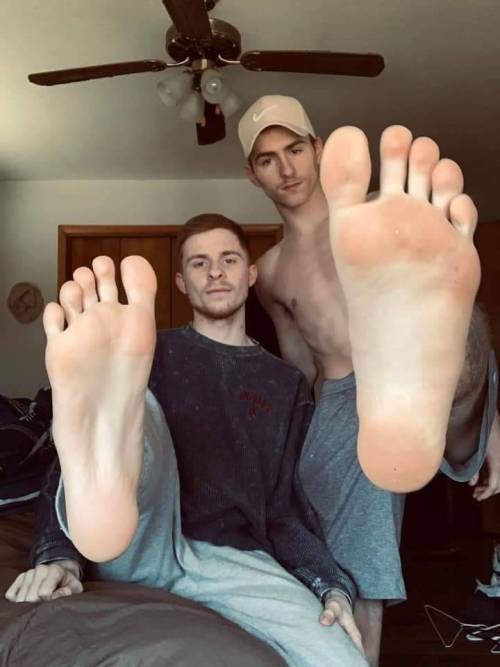 whitemalefeet:What’s better than one guy showing his feet?