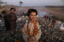 letswakeupworld: Afghan refugee children search through a dump