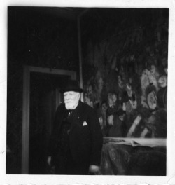  The Belgian Symbolist painter James Ensor in front of his painting Entry