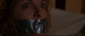 boundsilence:  In John Carpenter’s Vampires, Sheryl Lee plays a prostitute who has been bitten by a vampire. She passes out, and when she wakes up, she has been stripped, gagged with tape, and bound to a bed to prevent her from starting any trouble.