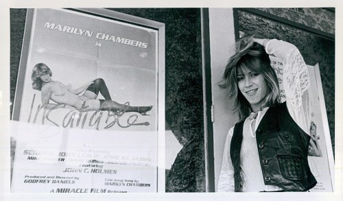 Marilyn poses outside an adult theater where Insatiable was playing, August 1980. Read about the film here.