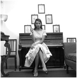books0977: Elsa Martinelli, at home, seated at her piano, 1957.