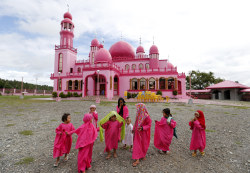 letswakeupworld:  Children walk outside the Pink Mosque after