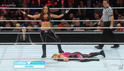Brie Bella’s victory pose over Natalya 
