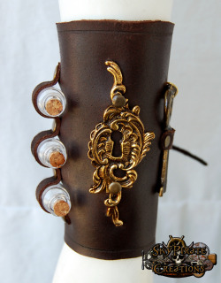 skypiratecreations:  The Alchemist Leather Bracerhttps://www.etsy.com/listing/151608719/steampunk-the-alchemist-leather-bracer?ref=shop_home_active_14