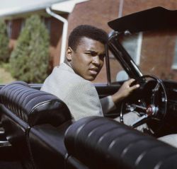 hopeful-melancholy:  A young-looking Ali behind the wheel of
