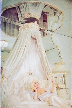 dollpeach:  Mae West reclines on a typically understated bed