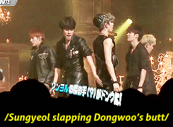  Dongwoo trying to protect his precious booty from a fan 