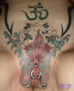 pussymodsgalore  Pierced pussy with tattoo. Two outer labia piercings