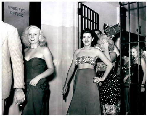 Vintage press photo dated from August of ‘49 features Miami vice officers escorting a group of dancers thru police headquarters.. All were arrested at Helene Polka’s infamous ‘JUNGLE CLUB’; including (at Extreme Right) featured performer: