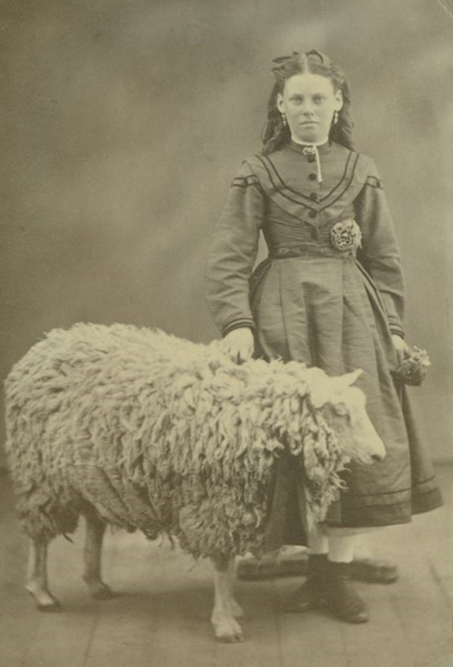 facesofthevictorianera:  	Portraits of children by State Library Victoria Collections    	Via Flickr: 	ca. 1880 - ca. 1900  Image H2005.34/281  Girl, whole-length, full face, wearing calf length full skirted frock, standing with right hand resting on