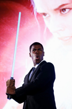 soph-okonedo:    John Boyega poses with a lightsaber at the ‘Star