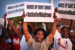 dichotomized:  Demonstrators protest the killing of teenager
