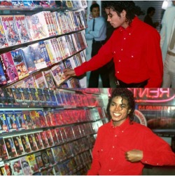 pokemoney: MJ thumbing through some anime videos in Japan (c.