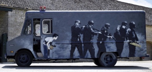 carsthatnevermadeitetc:  GMC SWAT van, 1985 (2006), by Banksy. An artwork by the British artist is to be auctioned by Bonhams tomorrow with an estimate of 跂-430,000. The van depicts a little boy about to prank a SWAT team on one side, and Dorothy from