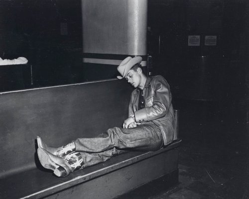 z0v: COWBOY ASLEEP ON BENCH [C. 1960]  Weegee