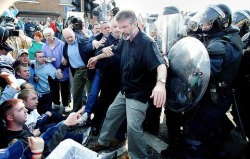 oglaighnaheireann:  Gerry Adams attempting to keep the peace