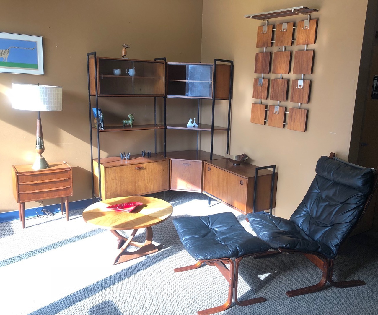 <p>Many countries have stunning mid century furniture. Five nations represented in this photo.</p><p>Tony Paul lamp, USA. Small dresser and Georg Jensen coffee table, Denmark. Corner shelf by Avalon, UK. German coat rack. Ingmar Relling chair, Norway.</p>
