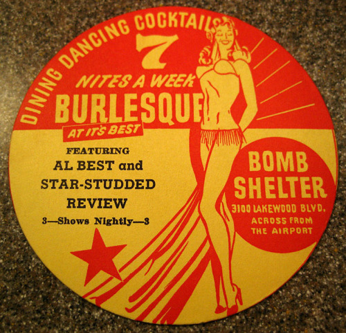 Beautiful graphic design is featured on a vintage 50’s-era coaster from ‘The BOMB SHELTER’.. This nightclub was operated by Hank Bickles and Jack Groat; and was located in Long Beach, California..