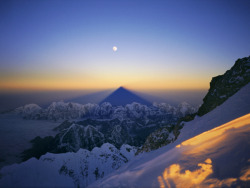 As far as the eye can see (the shadow of Mt. Everest, at sunrise, stretches to the opposite horizon)