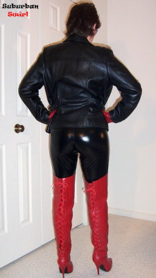 suburbanswirl:Lycra wet-look catsuit by Skinzwear, leather jacket