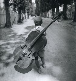 back-then:  Boy with a cello⁣Hungary, 1931⁣Photo: Eva Besnyö⁣⁣