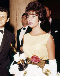  Elizabeth Taylor with her Oscar for Butterfield 8, 1961.  