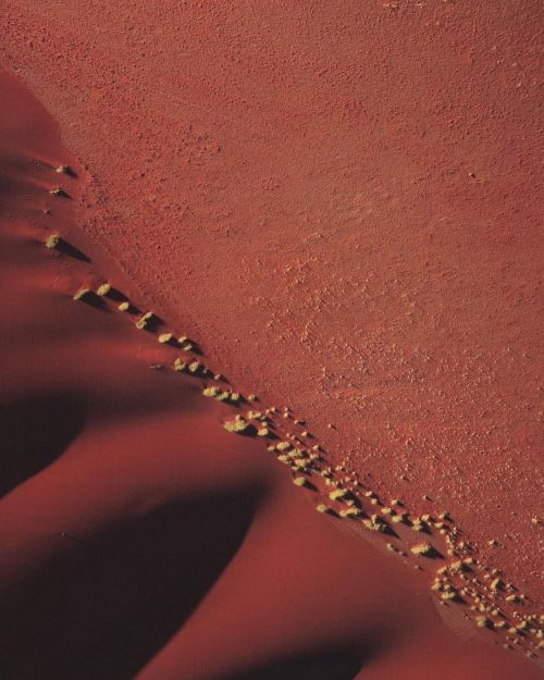 pg-mag:  Red sand dunes coloured by iron oxide, Namib Desert,
